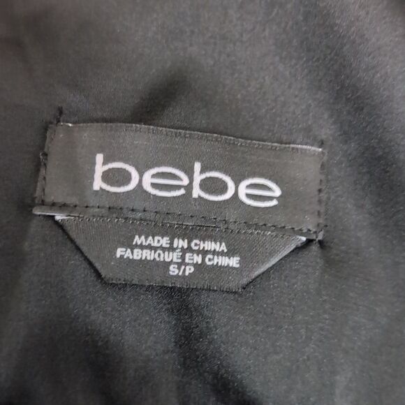 Stunning Bebe NWOT flowy maxi tired dress with lace details animal print… - Picture 11 of 17